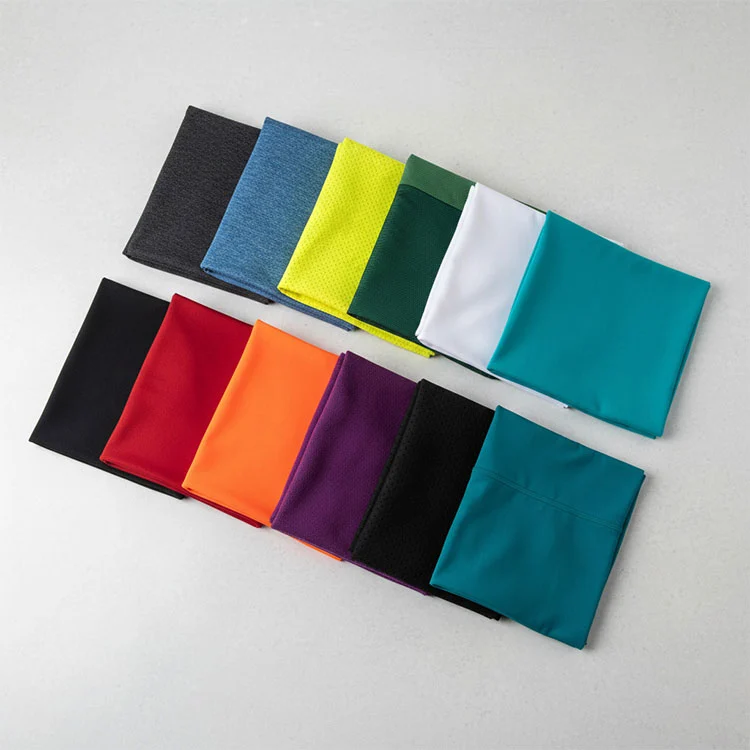 What are the key differences between nylon and spandex in performance sportswear